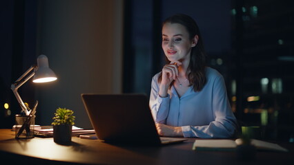 Positive employee talking virtual conference in night office smiling closeup. 