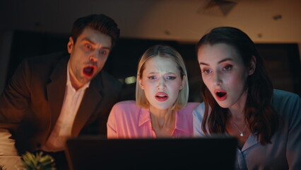 Office managers losing deal shocked on business news laptop late evening closeup