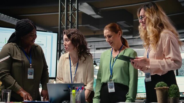 Group of corporate women working on data analysis and setting project goals, empowered and ambitious coworkers doing business planning. Goals oriented collaboration drives modern success. Camera A.