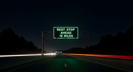 Rest Stop Sign At Night On Highway With Cars Lights Long Exposure
