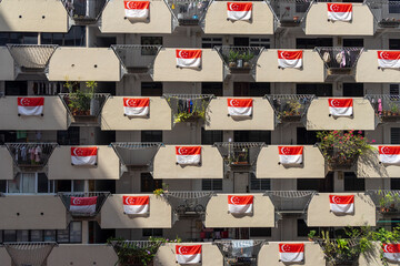 Singapore flags hang on the HDB housing flat