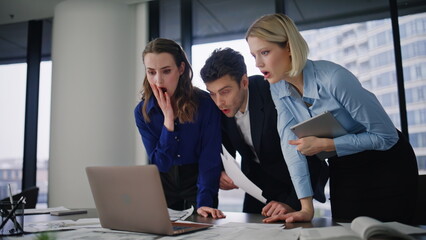 Business team failing deal looking laptop with frustration. Stressed partners