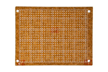 Rectangular prototyping circuit board with grid markings is isolated.