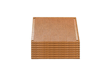 Stack of copper prototyping boards with perforated layout is isolated.