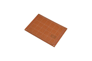 Small perforated prototyping board with coordinates is isolated.