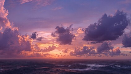 Fototapeta premium Panoramic sunset over a stormy sea. Vast, colorful sky with clouds of varying shades of purple, pink, and orange. The sun sets below the horizon. Ocean waves are visible