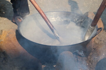 Dodol Making Process During Cultural Celebration in Southeast Asia

Hands Stirring Dodol Batter in...