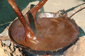 Traditional Dodol Making Process in Asian Village Kitchen

Hand-Stirring Dodol in Large Wok During...