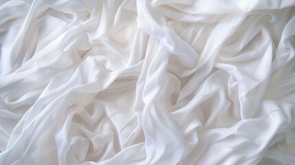 Fototapeta premium Soft, white fabric with a crumpled texture creates an elegant backdrop for showcasing natural eco textiles. Perfect for design projects.