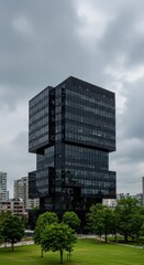 Fototapeta premium Modern skyscraper in a park