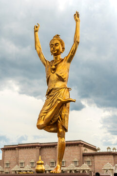 Robbinsville, NJ - US - Aug 2, 2025 A 49-foot golden statue of Bhagwan Swaminarayan at Nilkanth Plaza of BAPS Swaminarayan Akshardham, engaged in deep yogic prayer. Symbolizing spiritual focus.