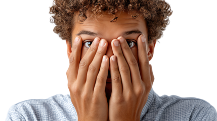 Emotions Unveiled: Capturing a moment of vulnerability, this image showcases a person partially obscured, hands covering their face in a display of trepidation.