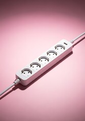 White power strip with multiple sockets casting elongated shadows on pink surface