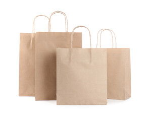 Many kraft paper bags isolated on white