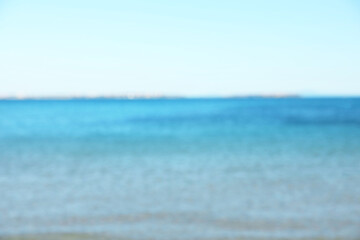 Obraz premium Beautiful sea under light blue sky, blurred view