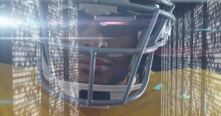 Standing helmeted athlete wearing yellow jersey scanning binary code in studio, with flare streaks