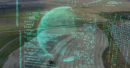 Hovering translucent turquoise digital globe above rural farmland, with streaming code overlay
