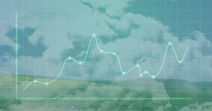 Fototapeta Displaying grid overlay with axes across rural meadow hills, neon green line chart and data nodes