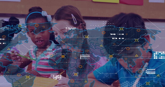 Drawing group of children using colored pencils at classroom table, with digital world map overlay
