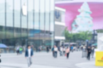 A blurred view of a busy city street in Hangzhou, China.