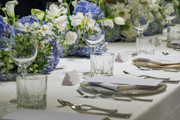 wedding reception dinner table suit set up with decoration flower before evening event start