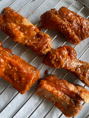 Marinated pork ribs on cooling rack.