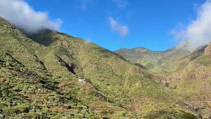 Fototapeta premium Breathtaking views of mountains, greenery, and blue skies, showcasing nature's beauty and tranquility.