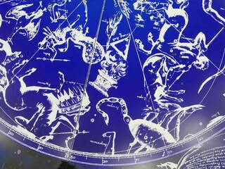 Constellations shining on a blue celestial map