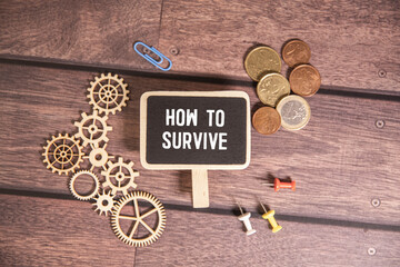 How to survive from wooden blocks on vintage background. Survival concept.