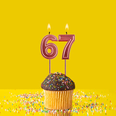 Birthday on a yellow background - Number 67 candle