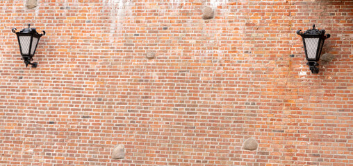 Vintage Wall Lantern Illuminating a Rustic Red Brick Wall