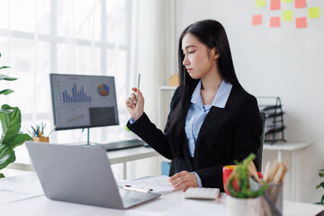Business woman Accounting using calculating income-expenditure and analyzing real estate investment...