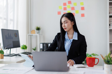 Business woman Accounting using calculating income-expenditure and analyzing real estate investment...