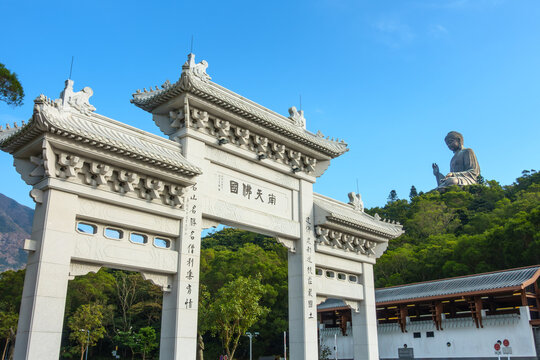 Hong Kong - October 30, 2014 : Buddhist World in the South Archway. Tian Tan Buddha Statue Po Lin Monastery, Ngong Ping Village, scenery big buddha on mountain, religion sacred landmark of tourist.