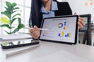 Business asian woman working at office with tablet and document, doing planning analyzing the...