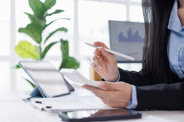 Tax payments, accounting for business, financial literacy, A business asian woman keeps records...