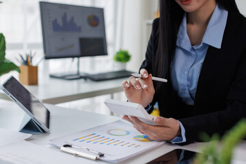Tax payments, accounting for business, financial literacy, A business asian woman keeps records...