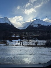 Panoramic View of Snowy Mountains on a Clear Winter Day
