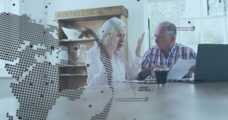 While studying paper, senior couple reviewing business details with digital globe and code overlay - Powered by Adobe