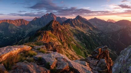 Fototapeta premium Mountain peaks at sunset. Rocky mountain ridge at sunrise