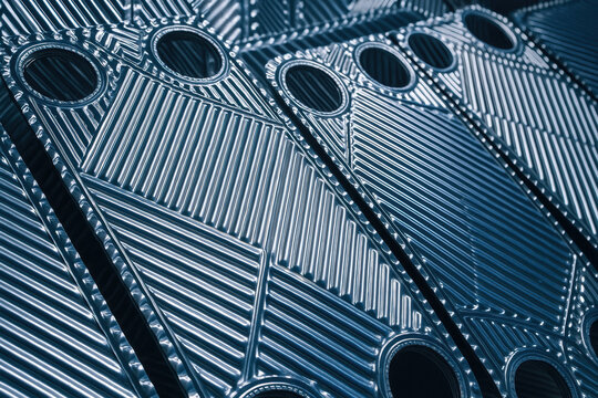 Heat exchanger plates arranged in row with metallic texture used in industry for efficient heat transfer and energy saving in various applications