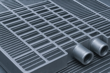Heat exchanger component close up with metal fins designed for efficient heat transfer in industry applications and cooling systems