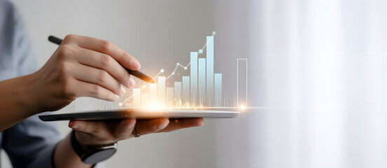 Unveiling Growth: An individual interacts with a digital tablet, visualizing a rising growth chart, signifying data analysis and technological integration.