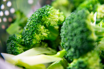 Fresh Green Broccoli Florets in Colander &ndash; Healthy Cooking Preparation