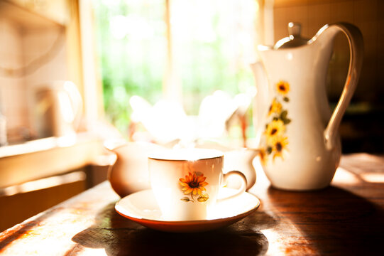 Vintage Floral Tea Set in Warm Morning Sunlight &ndash; Cozy Kitchen Scene