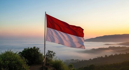 National flag waving over misty hills