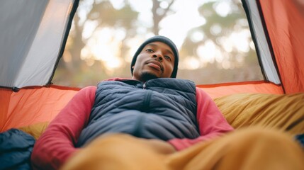 A Relaxing Moment Inside a Tent with a Calm Individual Enjoying Nature's Beauty and Peace in the Great Outdoors