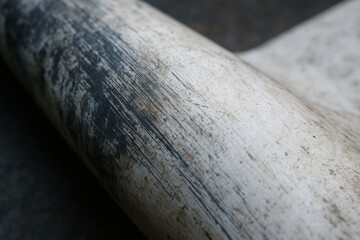Worn pipe surface with scratches and dirt marks representing engineering work in energy sector with industrial texture and material