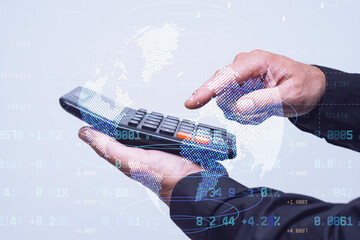 Calculator in man hands with holographic digital globe and financial data overlay. Global business security, financial protection, and international economic analysis concept.