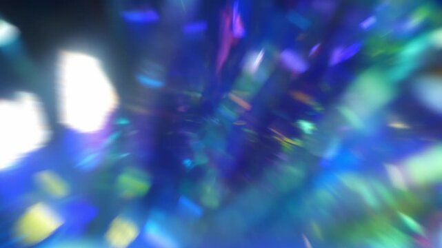 Defocused shiny blue green and purple light leaks. Festive neon abstract holographic modern background for party. Blurred glow